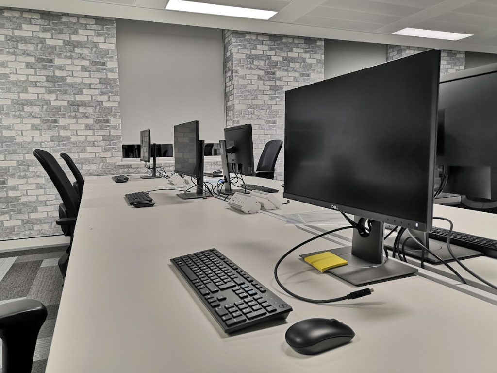 Computers all lined up in an office